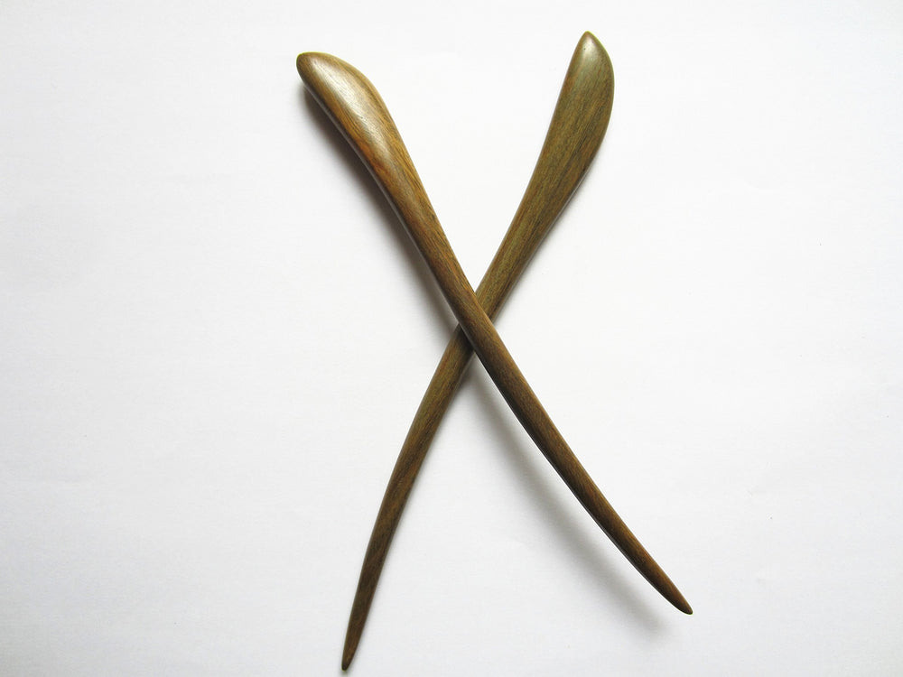 Myhsmooth hair bun with sticks in place demonstrating secure, elegant hold