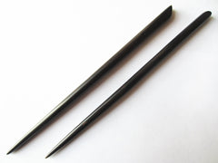 Myhsmooth hair sticks inserted in bun demonstrating secure, polished updo