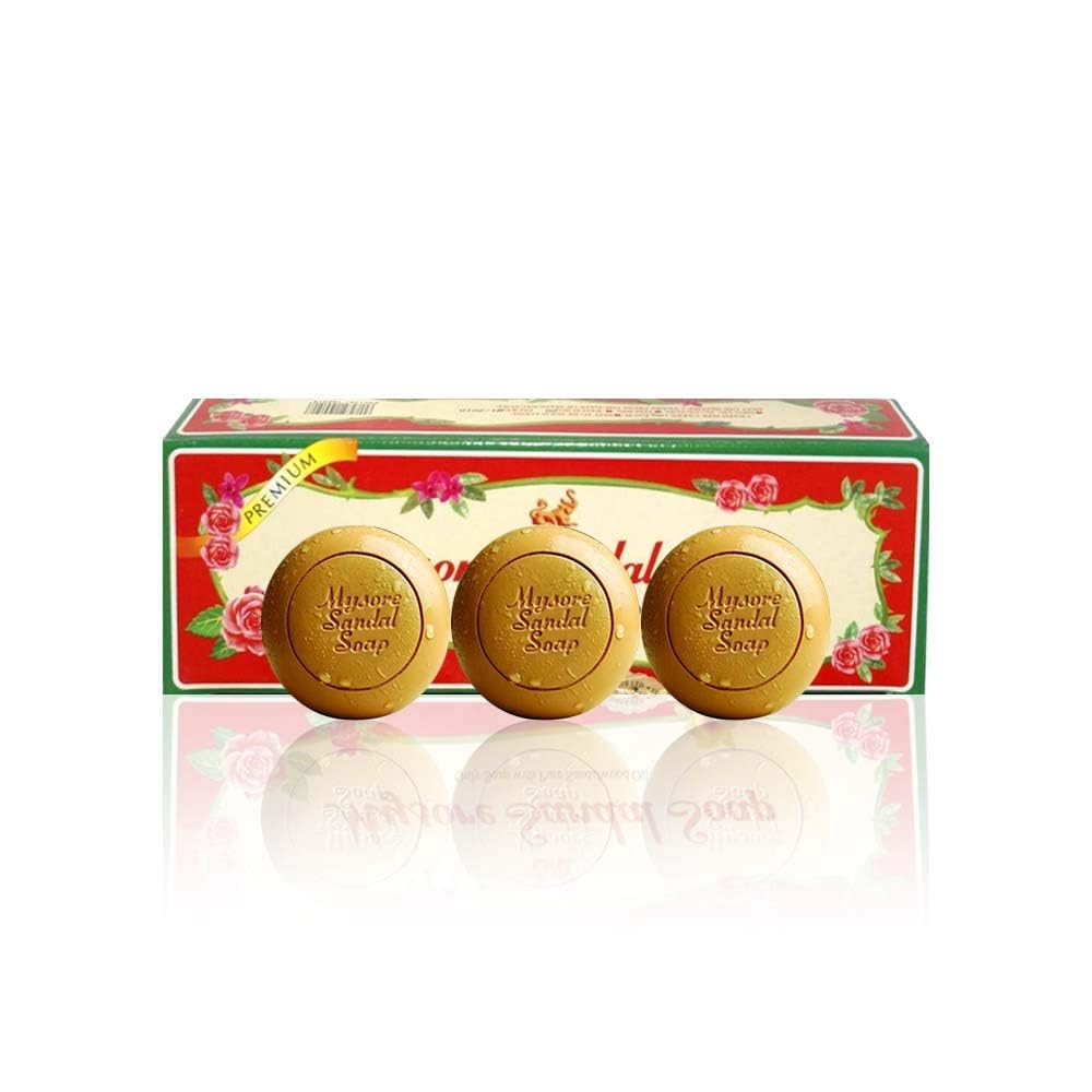 Mysore Sandal soap next to hand for scale showing generous 150g bar size
