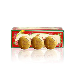 Mysore Sandal soap next to hand for scale showing generous 150g bar size