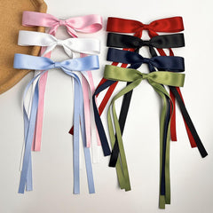Mythos lifestyle shot wearing bow clip for an elegant evening look