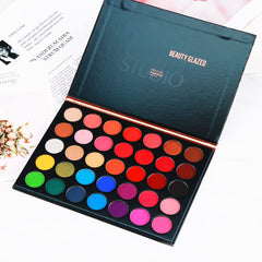 MYUANGO palette in hand to show compact size and portability benefits