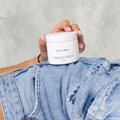 NAELI retinoid cream on nighttime vanity illustrating evening skincare ritual