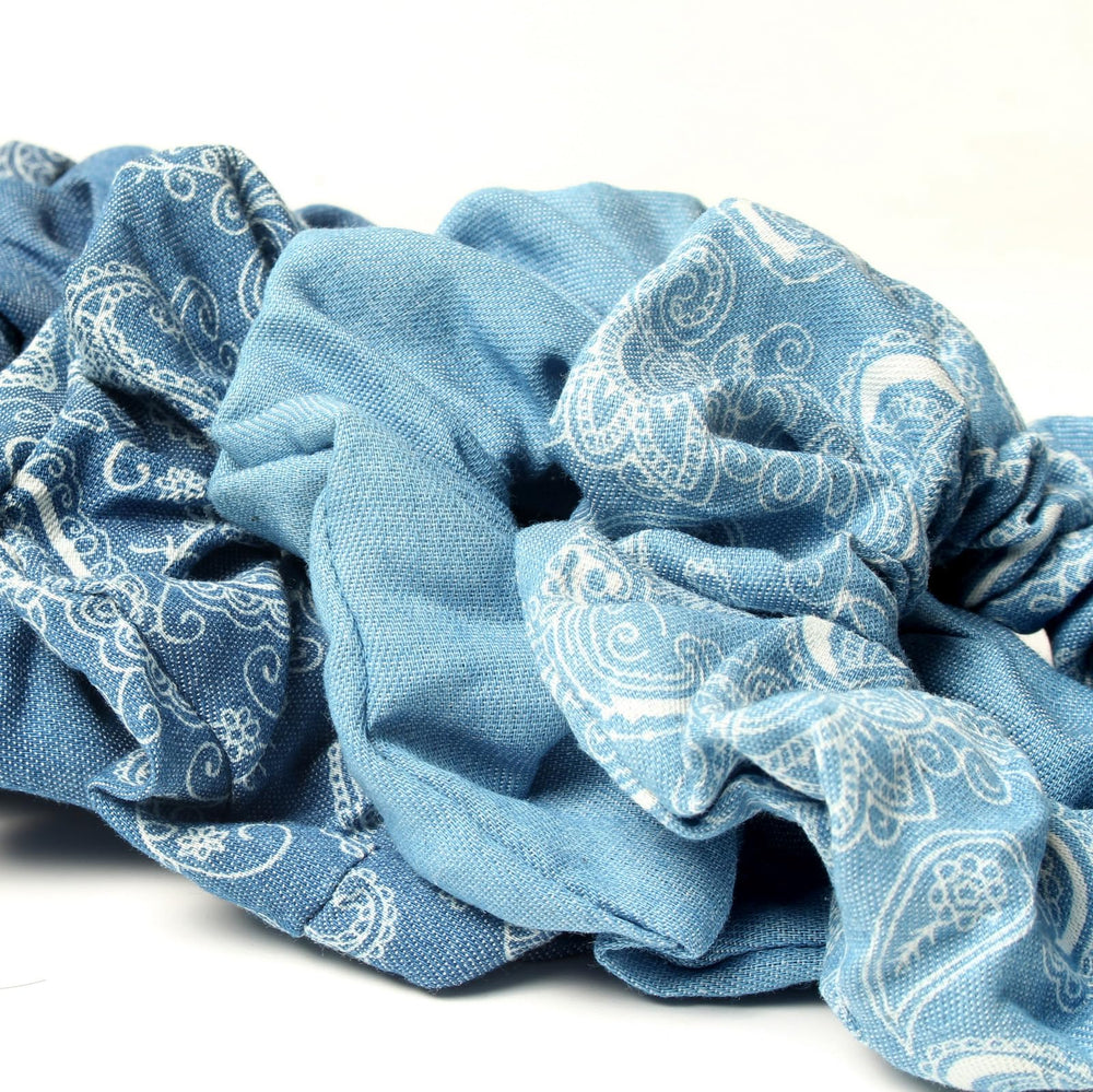 naibirdr scrunchie forming a bun to show volume control and no-slip hold