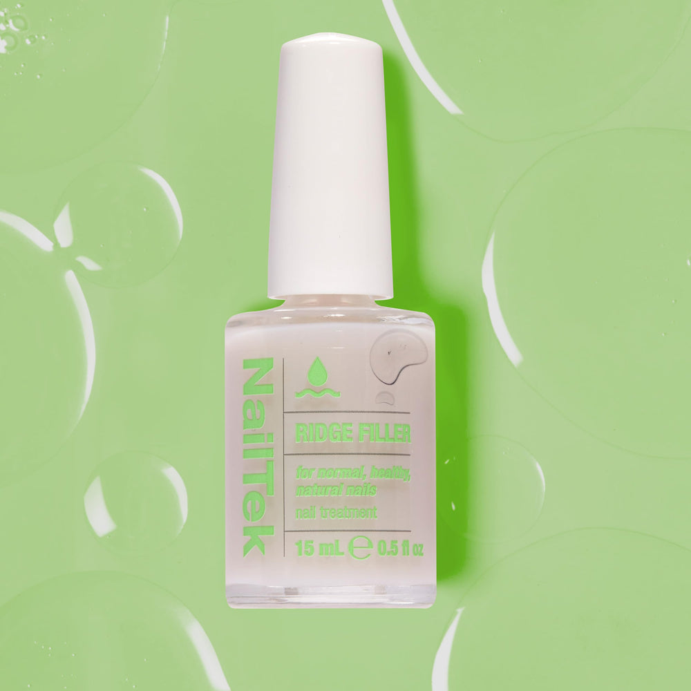 Lifestyle image of hands using Nail Tek showing polished, even nails