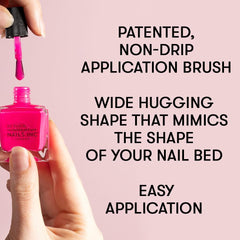 Nails Inc bottle next to a hand for scale to show compact travel-friendly size