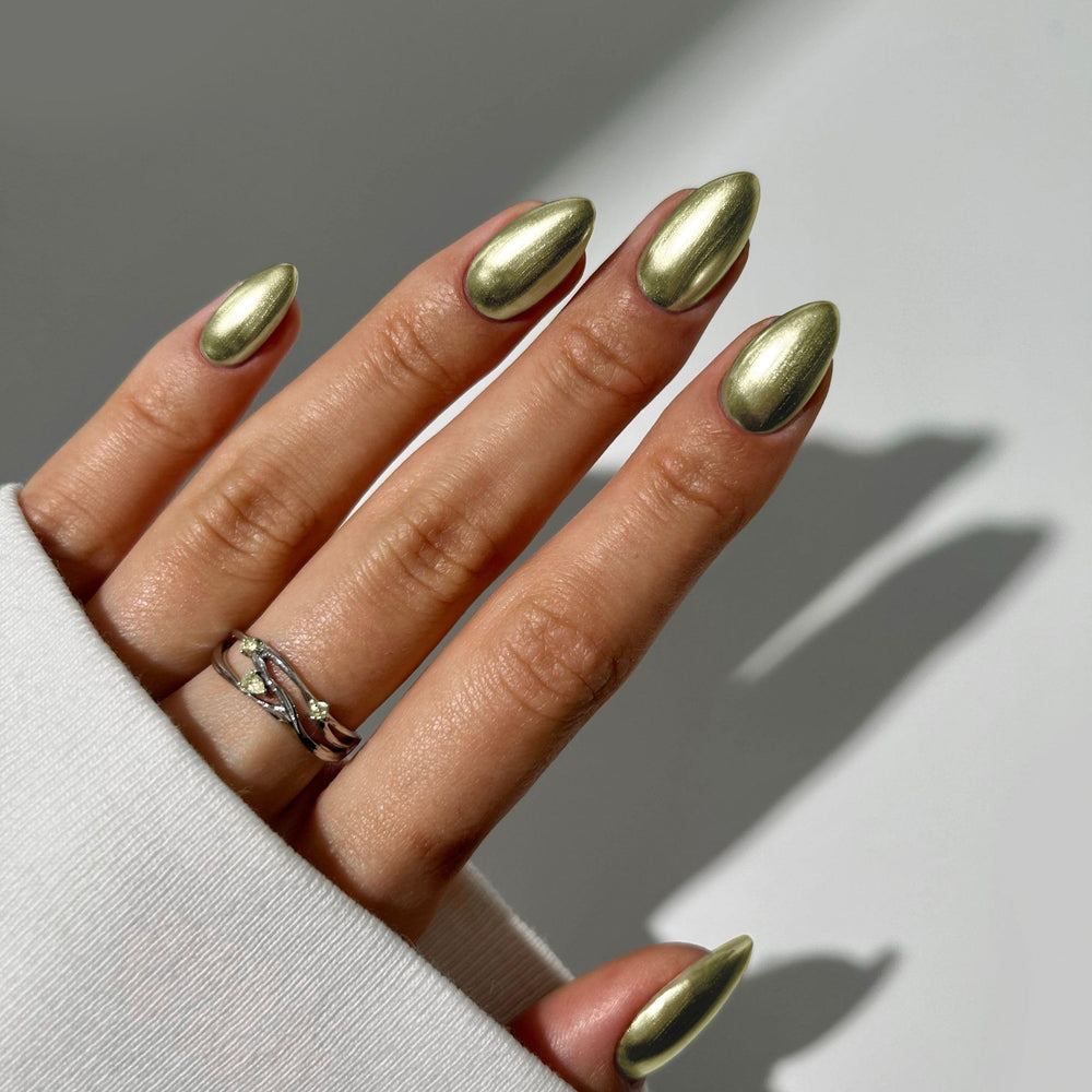 Nails Inc swatch on fingernail showing streak-free mirror chrome shine