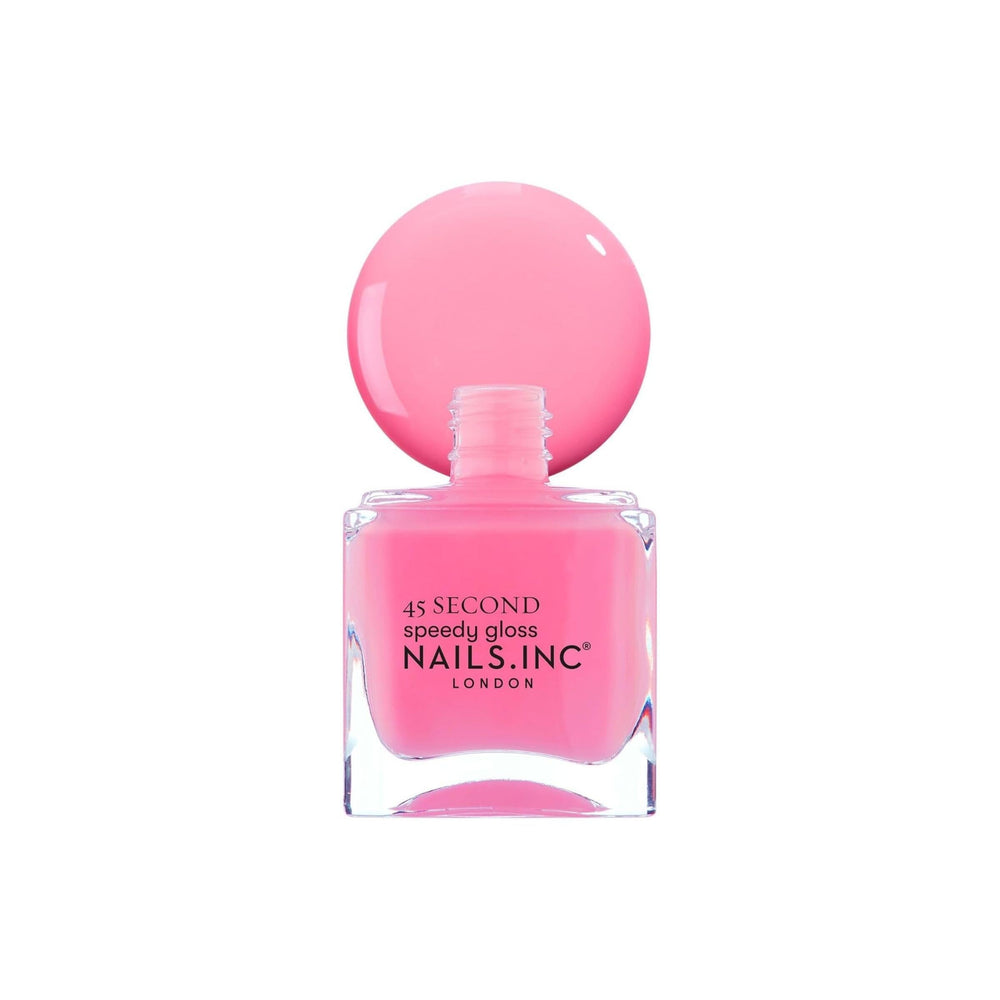 Nails Inc Taylor next to a coin for scale to show 0.47 fl oz bottle size benefit
