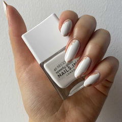 Nails Inc swatch on skin showing opaque bright white color and streak-free coverage