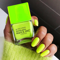 Nails Inc Daisy single swatch stroke showing streak-free neon coverage