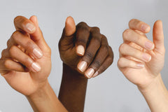 Nailtiques being applied to natural nail, illustrating strengthening benefit during use