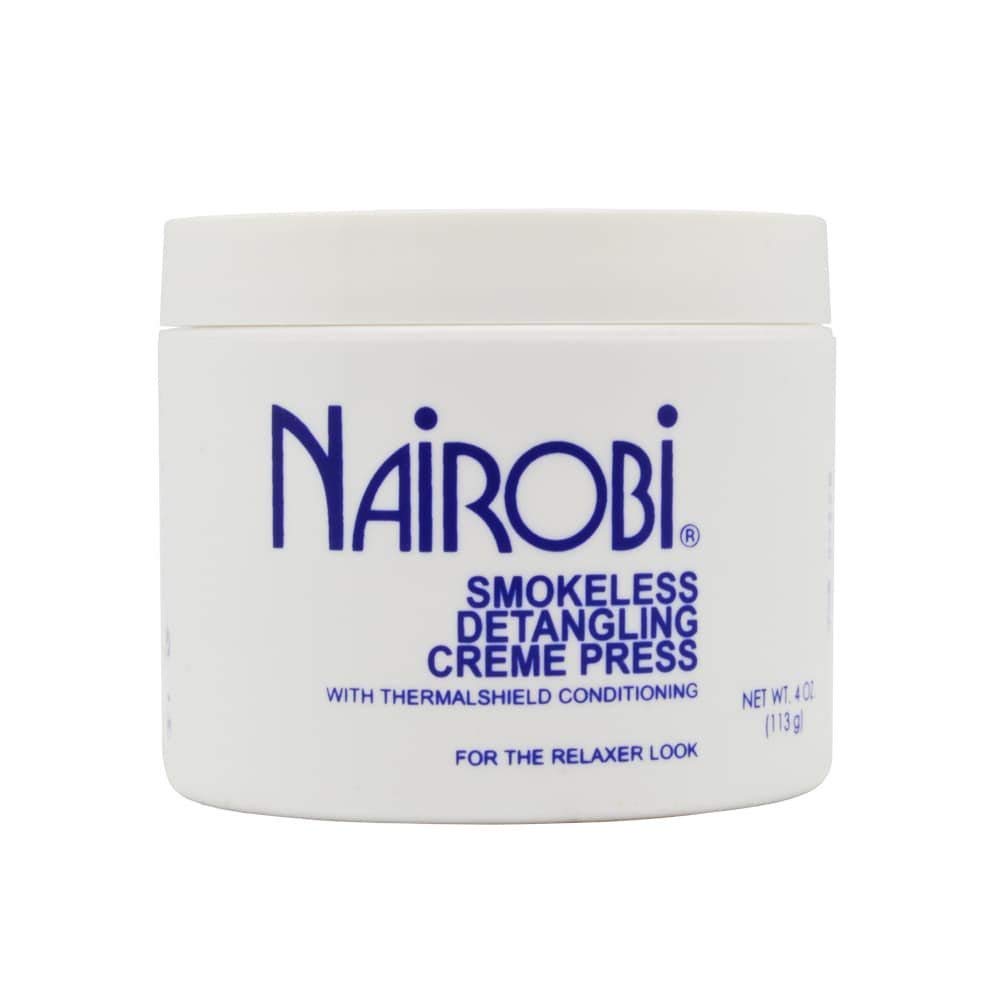Nairobi stylist applying creme to hair for faster smoke-free styling