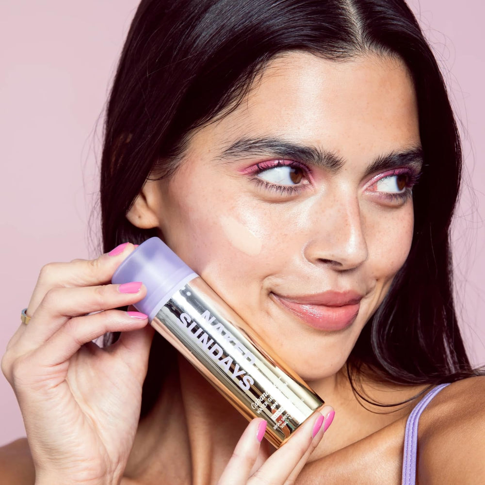 Naked Sundays serum smoothed on cheek, delivers dewy natural glow without grease