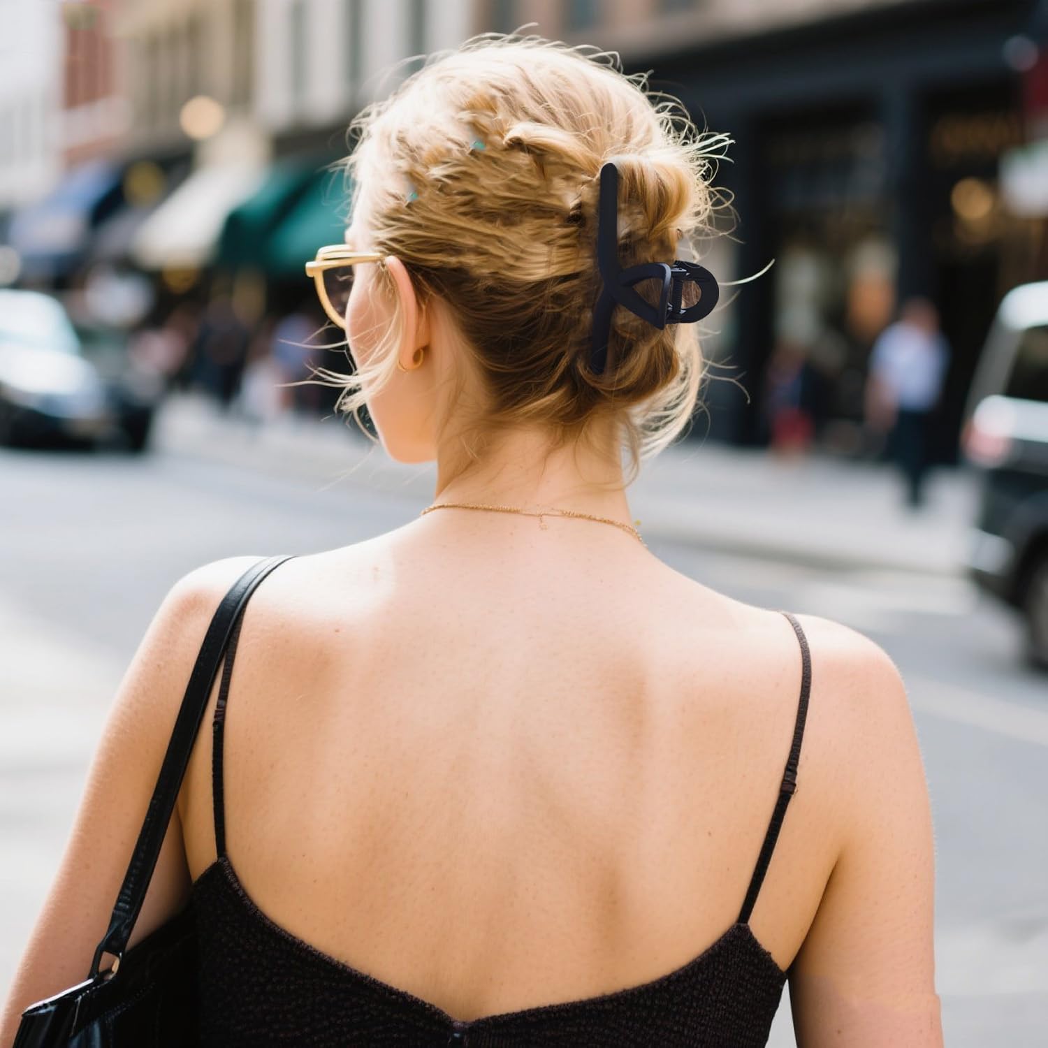 Nalodu clip holding long curly hair in an updo, demonstrates no-slip hold and comfort