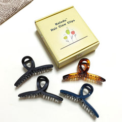Nalodu clip holding a high bun, comfortable all-day wear