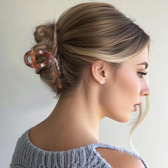 Nalodu clip holding a high bun on curly hair for all-day secure styling