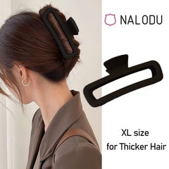 Nalodu clip securing a twisted bun on curly hair for secure hold benefit