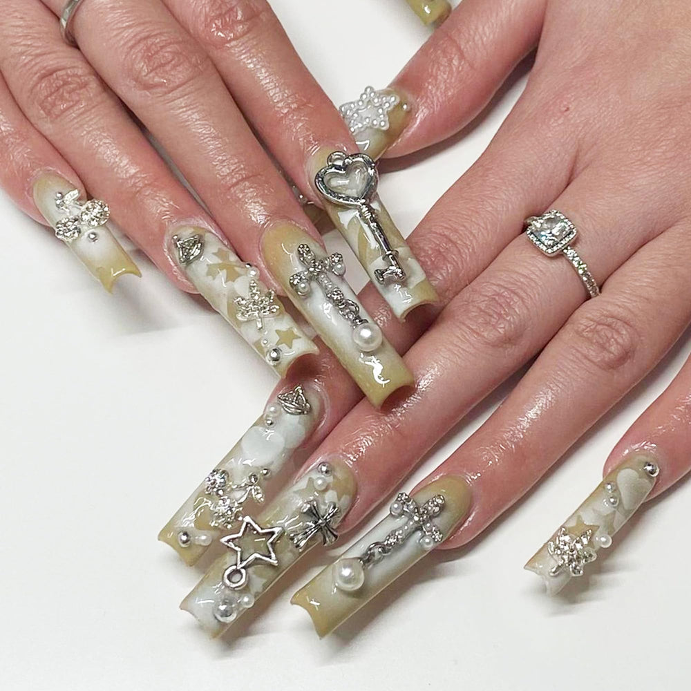Namifin charms on acrylic nail in use offering stylish nail accent