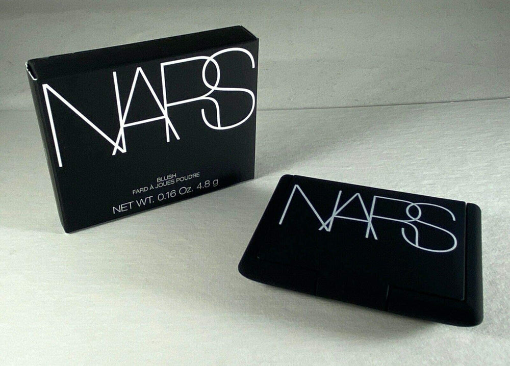 NARS Orgasm blush swatch on brush demonstrating buildable pigment
