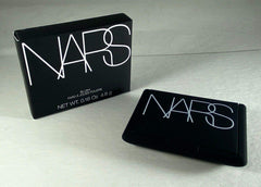 NARS Orgasm blush swatch on brush demonstrating buildable pigment