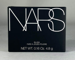 NARS Orgasm blush applied on medium skin for natural warm glow