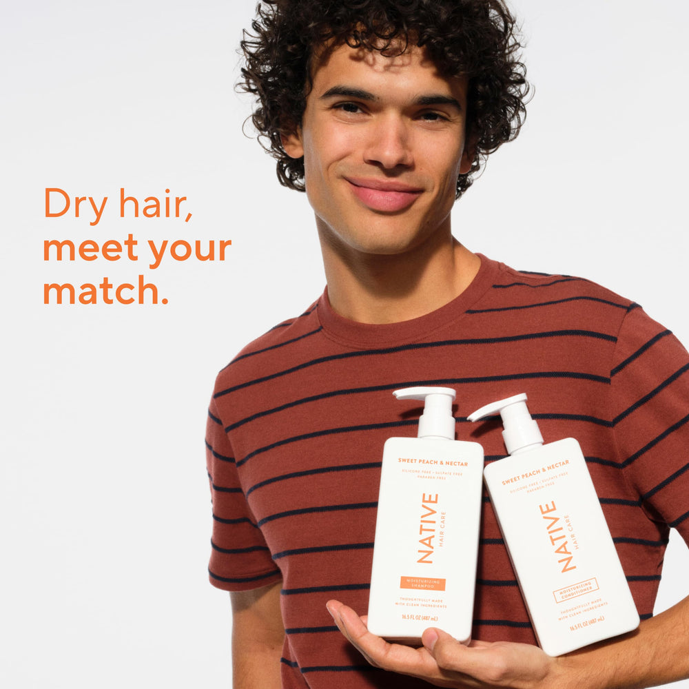 Bottle of Native conditioner in shower setup highlighting everyday use benefit