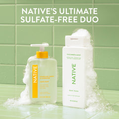 Native bottle on bathroom shelf setting a fresh, tidy shower scene