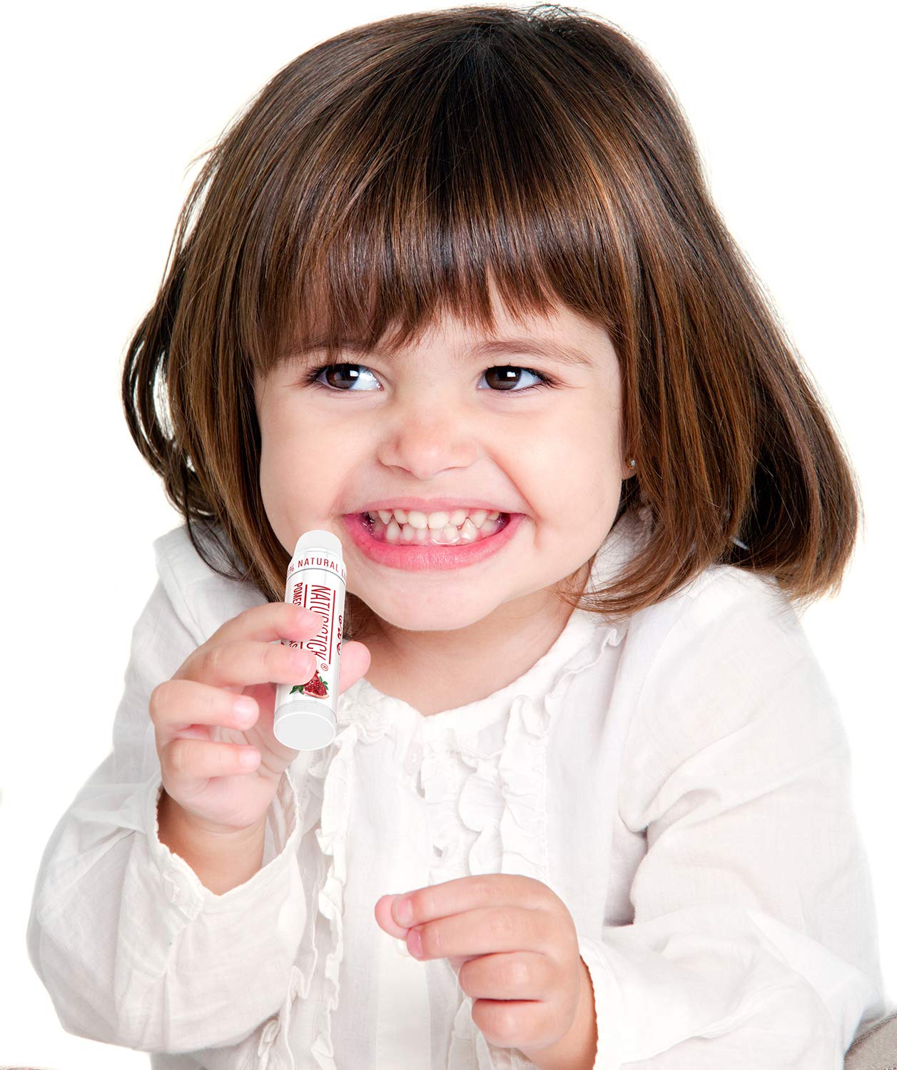 Naturistick in use with a tube beside a purse and laptop for on-the-go lip care