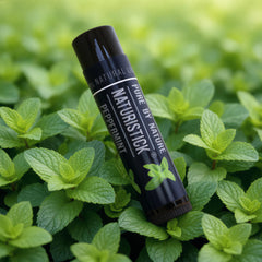 Naturistick used outdoors on lips to show refreshing peppermint sensation and on-the-go protection