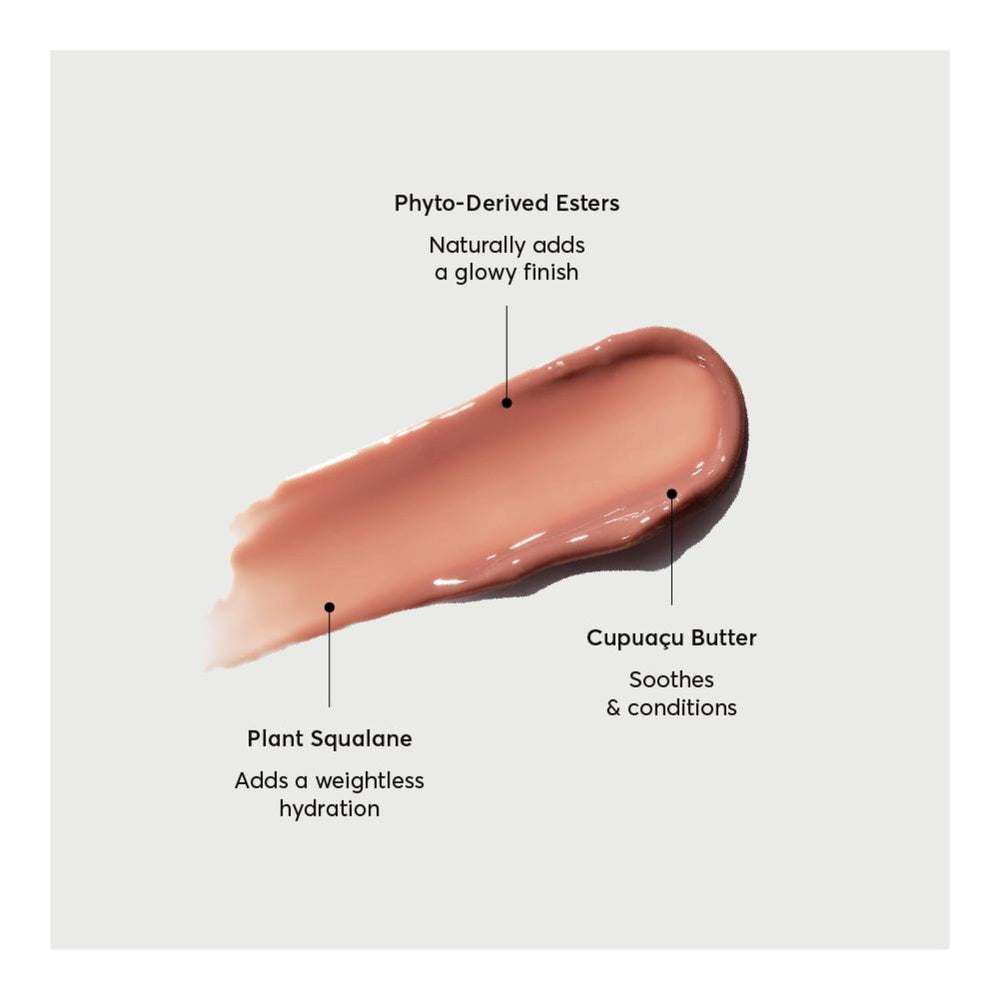 Person applying Naturium Phyto-Glow lip balm for instant glossy finish and hydrated lips