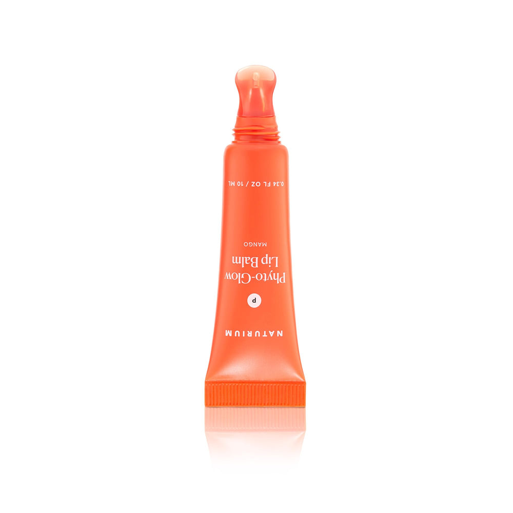 Naturium Phyto-Glow Lip Balm applied on lips in lifestyle setting showing dewy shine benefit