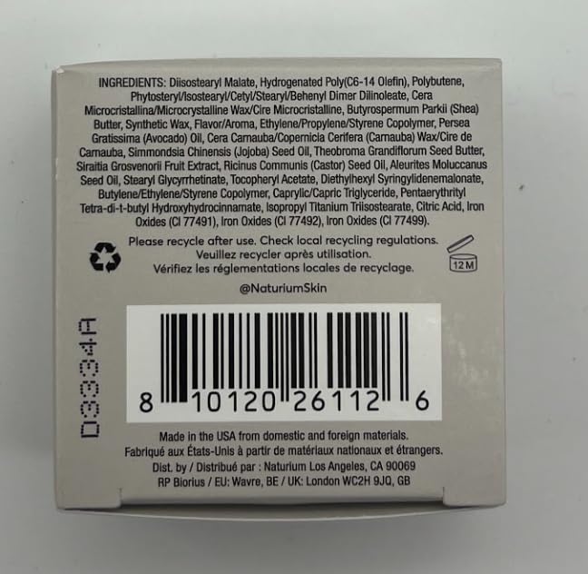 Lifestyle scene: Naturium Phyto-Glow in a handbag emphasizing on-the-go lip repair and nourishment