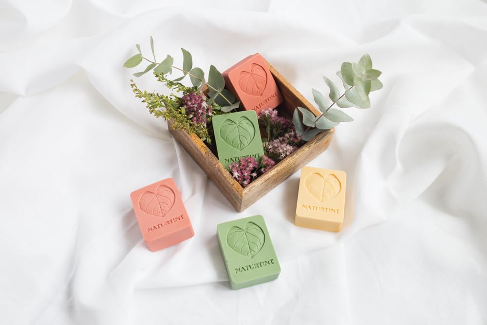 Naturtint bar resting on draining soap dish to extend product lifespan