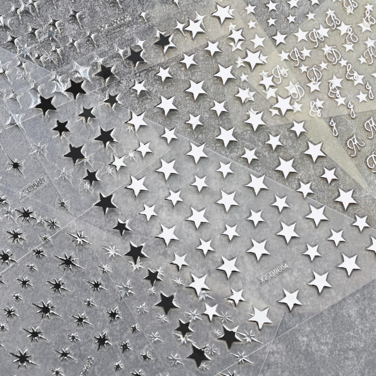 NBNTGH sticker application with tweezers demonstrating precise placement benefit