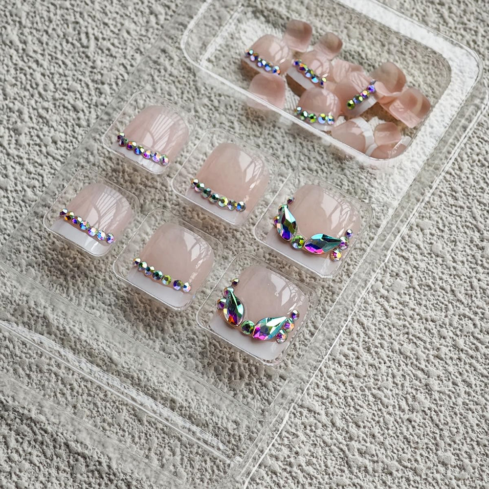 NBNTGH close-up rhinestone detail on white French tip for sparkle and polish