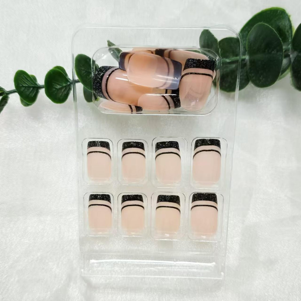 NBNTGH kit contents with 24 nails adhesive tabs and wooden stick for complete application