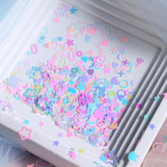 NBNTGH sequins next to a fingertip, size comparison for design planning
