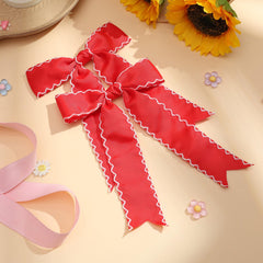 NCMAMA girl outdoors wearing bow showing charming, occasion-ready look