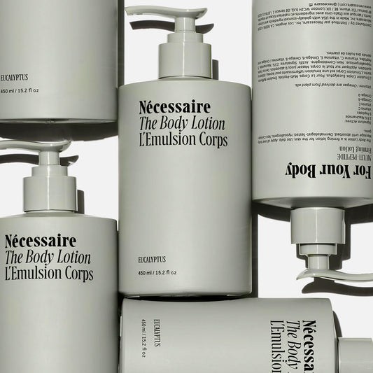 Nécessaire bottle pump and label detail highlighting ingredient transparency and use