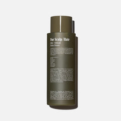 Nécessaire pump and label close-up highlighting easy dispense and clarity
