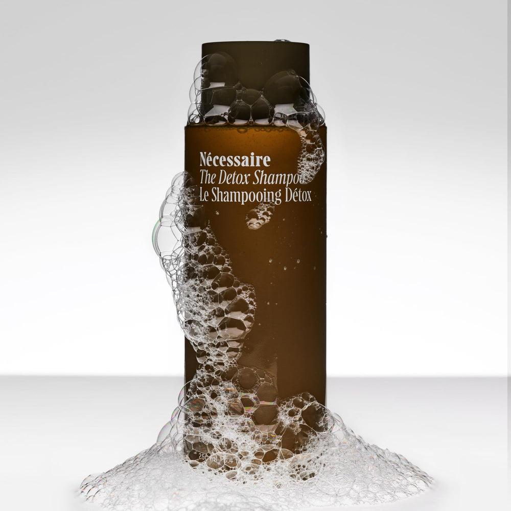 Nécessaire shampoo lather texture close-up showing gentle foaming action