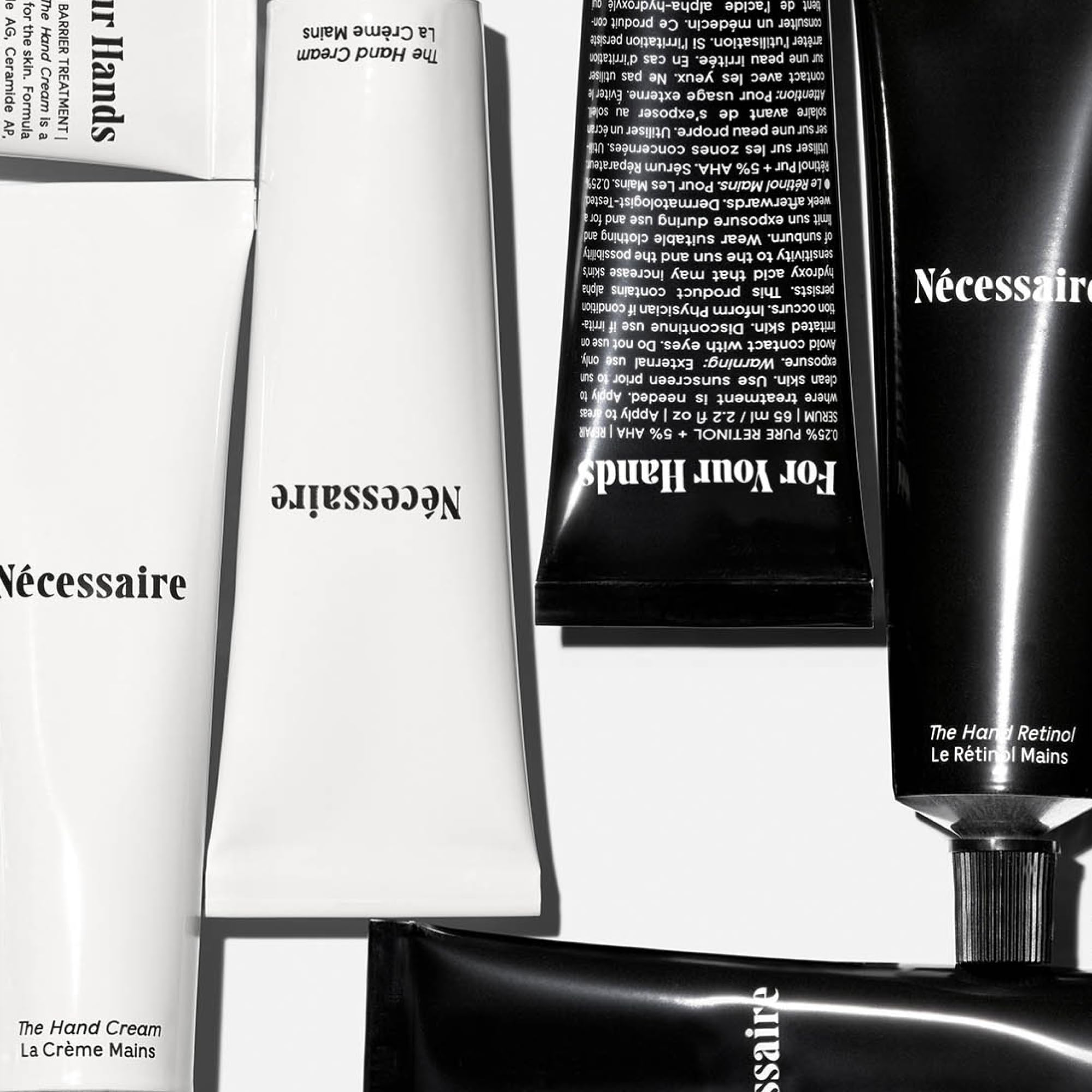 Nécessaire close-up of Hand Retinol balm texture showing creamy repair formula for nights