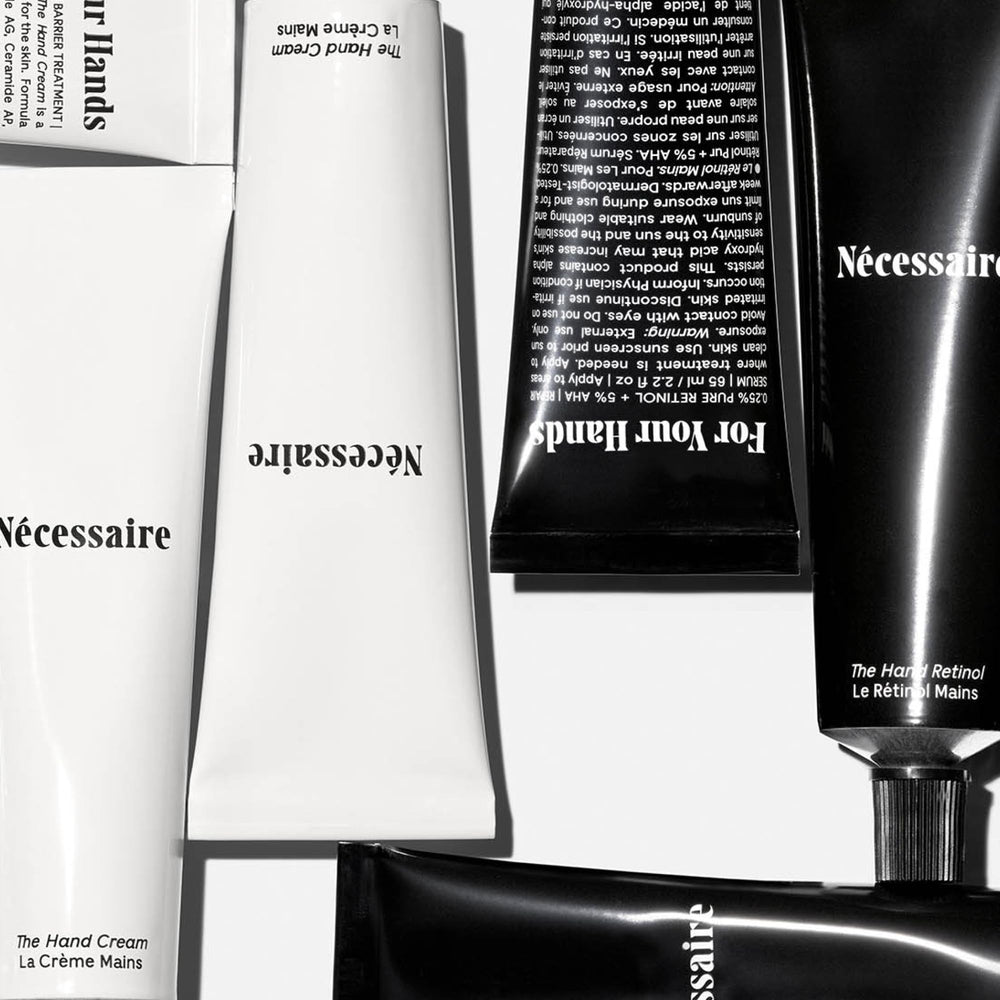 Nécessaire close-up of Hand Retinol balm texture showing creamy repair formula for nights