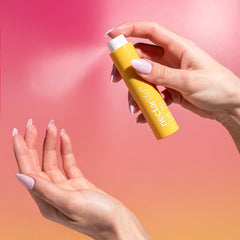 Nectar Life hand spray in action creating fine mist to hydrate hands quickly