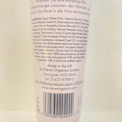 Neom hand balm on bedside table suggesting evening relaxation ritual