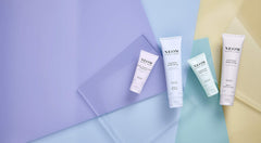 Neom hand balm next to common items showing 30ml travel-friendly size