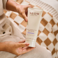 Neom open jar texture close-up showing rich buttery cream and easy absorption