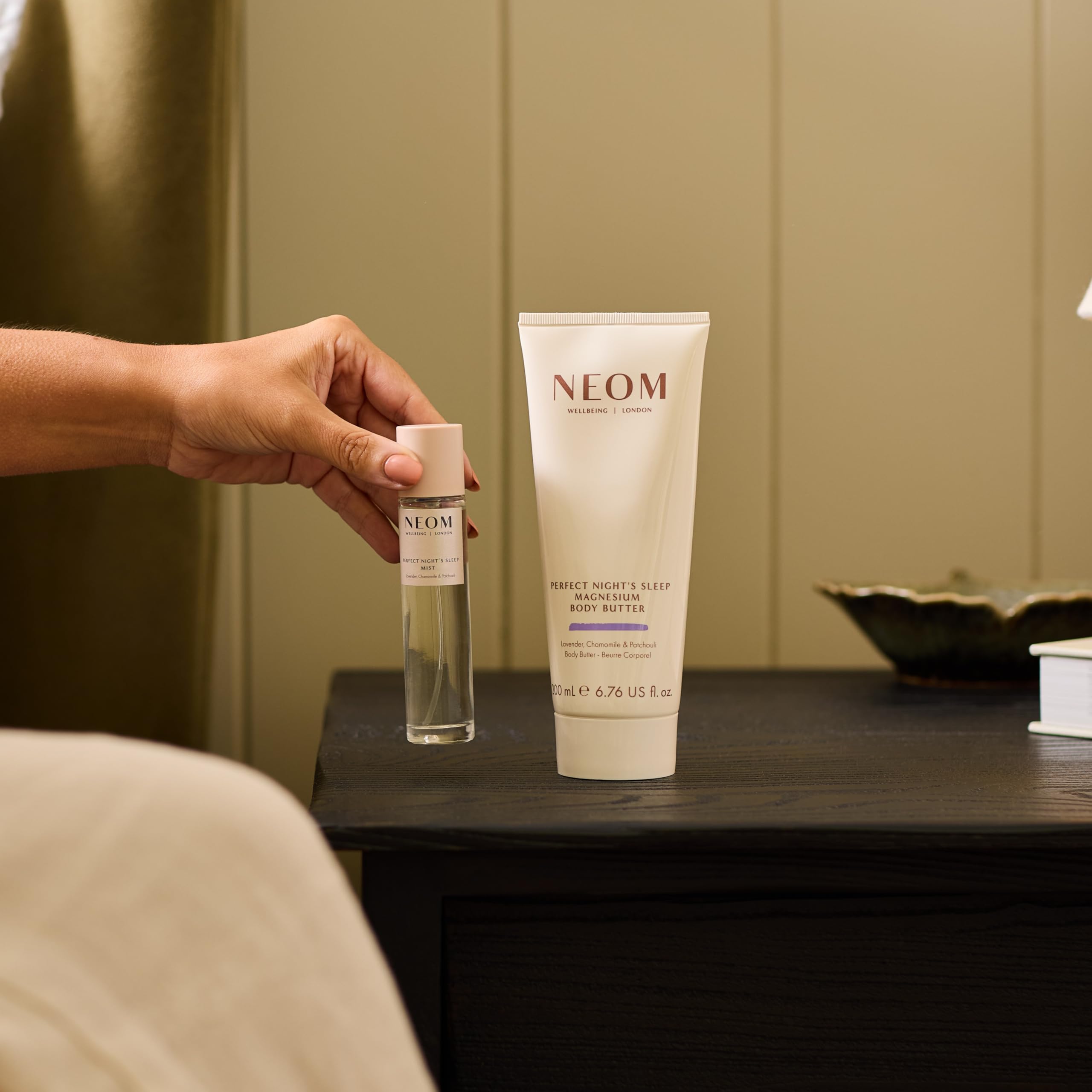 Neom jar with fresh flowers highlighting botanical scent and wellbeing gift