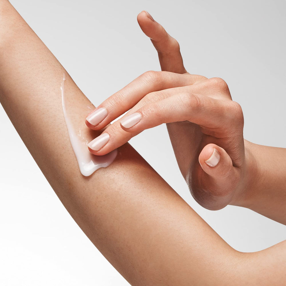 NEOSTRATA applying lotion to hands showing improved texture benefit