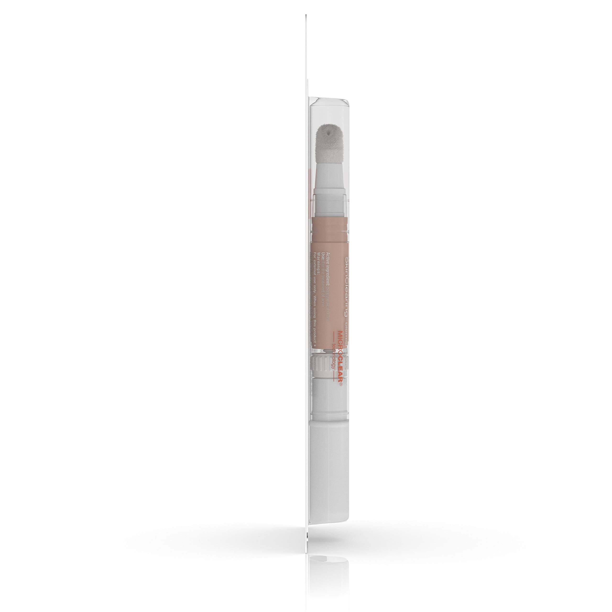 Neutrogena concealer flat lay with powder and brush for layering tips